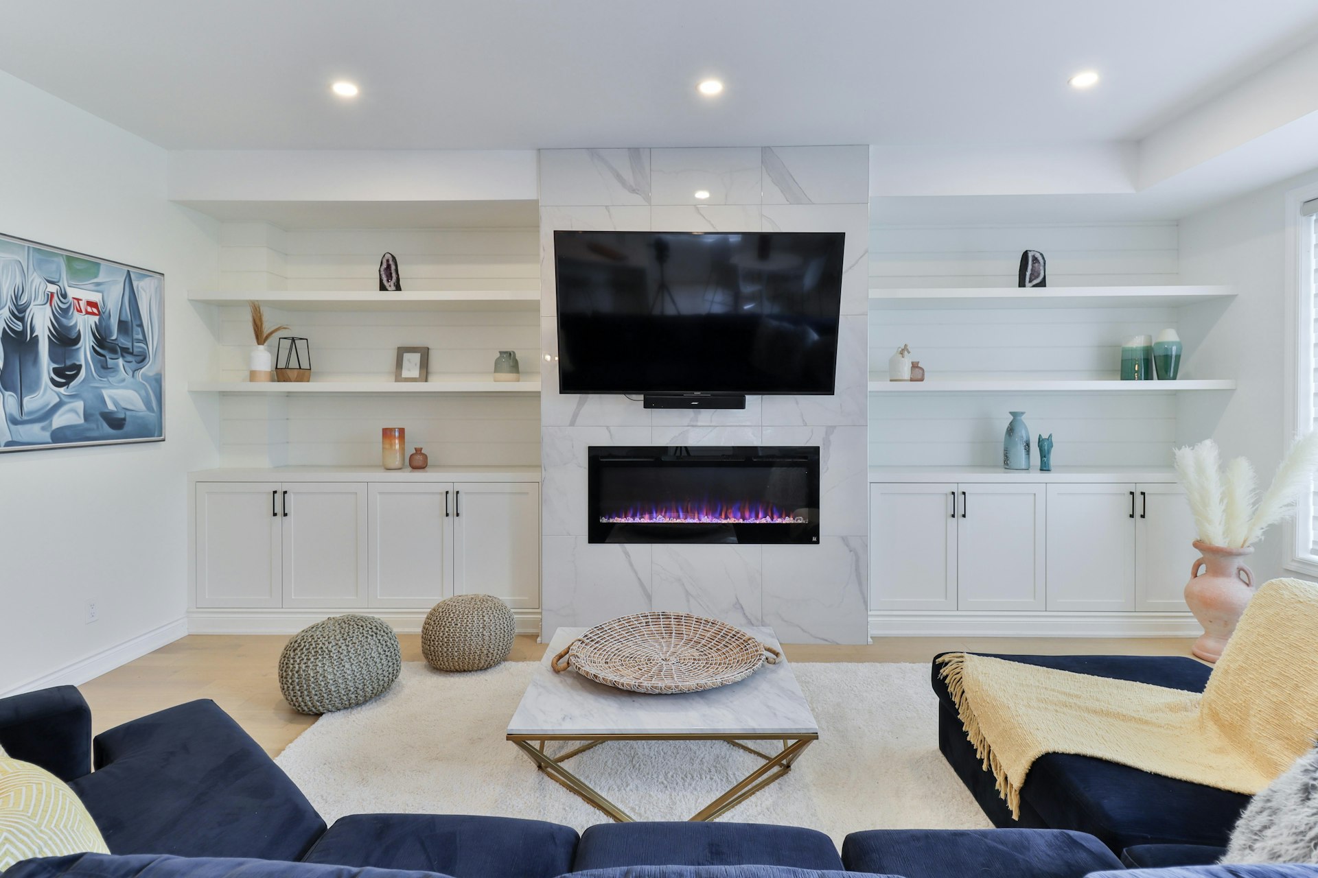 a living room filled with furniture and a flat screen tv